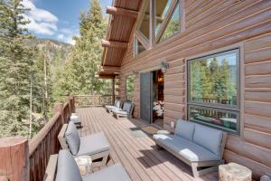 a deck with couches and chairs on a house at Durango Mountain Escape w/ Stunning Views in Durango