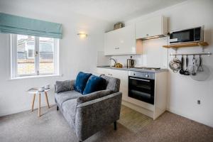 a living room with a couch and a kitchen at 1 Bed in St. Ives oc-pc466a in St Ives