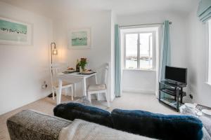 a living room with a couch and a table at 1 Bed in St. Ives oc-pc466a in St Ives