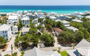 an aerial view of a town with the ocean at Tickle Me Tides in Inlet Beach