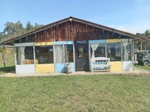a house with a bench in front of it at Luna Llena in Suesca