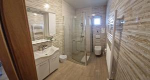 a bathroom with a sink toilet and a shower at Captain's Club in Rab +77 photos
