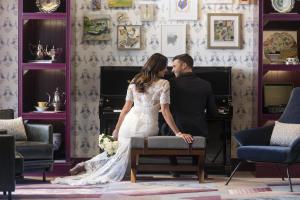 a bride and groom standing in front of a fireplace at Hyatt Centric Downtown Nashville in Nashville +67 photos