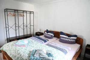 a bed with two pillows on top of it at FeWo Renken in Trassenheide