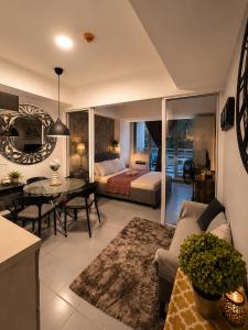 a large living room with a bed and a table at Azure Urban Resort Residences by Value Suites in Manila