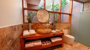 a bathroom with a sink and a mirror at Viscas Hotel Luxury Resort & Spa in Pariahuanca +72 photos