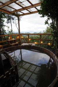 a pool in the middle of a patio with a fence at Tungulú - Hotel Boutique & Cabañas in Puerto Montt
