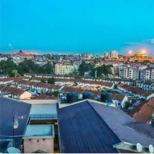 a view of a city at night with buildings at The Kilimani Executive Studio Haven with Gym&Restaurant in Nairobi