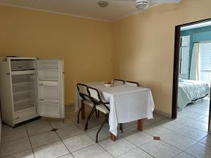 a dining room with a table and a bed at Lass Cahuelas in Federación