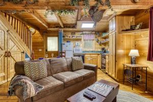 a living room with a couch and a kitchen at Precious Moments in Sevierville