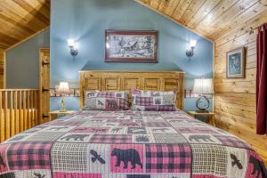 a bedroom with a bed and blue walls at Precious Moments in Sevierville