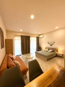 a large living room with two beds and a couch at NM Residence 2 in Shkorpilovtsi