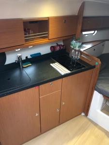a kitchen with a sink and a counter top at Escapade Antiboise avec parking inclus in Antibes