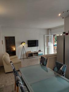 a living room with a couch and a table at Vila Brig 108 - private swimming pool and jacuzzi in Rijeka