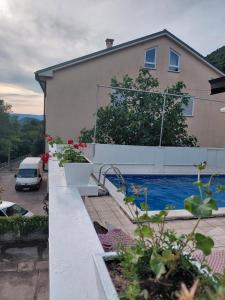 a house with a swimming pool in front of a house at Vila Brig 108 - private swimming pool and jacuzzi in Rijeka