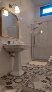 a bathroom with a sink and a shower at Sa Bonora in Iglesias