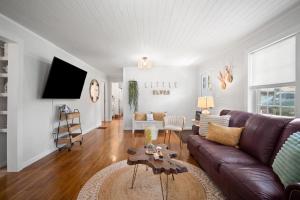 a living room with a couch and a table at Little Elves Overlook in Sparta