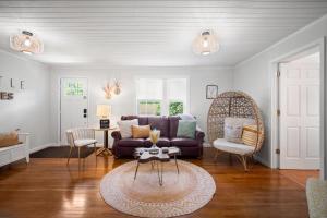 a living room with a couch and a table at Little Elves Overlook in Sparta +43 photos
