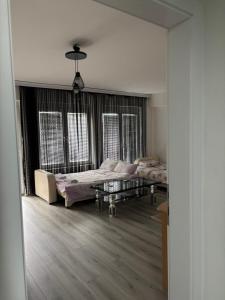 a living room with two beds and a coffee table at Apartment ANGELA Ohrid in Ohrid