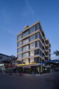 a tall building with a sign on the side of it at Duyên Hùng Premier Hotel in Diện Biên Phủ