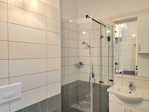 a bathroom with a shower and a sink at Wide Beach Apartments 236 in Mullini i Danit +14 photos