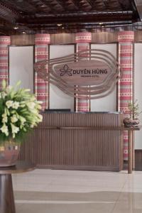 a booth with a sign for a juivenling manufacturer at Duyên Hùng Premier Hotel in Diện Biên Phủ
