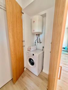 a laundry room with a washer and dryer in it at Cala Crancs - Sea Views in Salou
