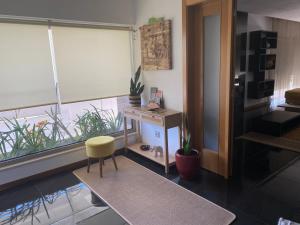 a room with a desk and a chair and a window at Casa do Vale Vintém in Condeixa a Nova
