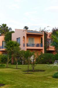 a building with a yard in front of it at La Villa Mandarine in Rabat