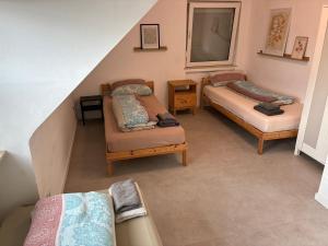 an overhead view of a living room with two beds at Hauckwald Apartment 1 in Alzenau