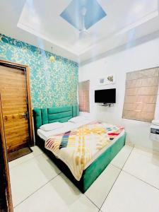 a bedroom with a large bed in a room at Hotel RKS Residency in Bathinda