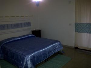 Postel nebo postele na pokoji v ubytování La Quercia
