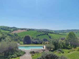 an aerial view of a swimming pool in a green field at Casal dei Fichi in Francavilla dʼEte