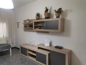 a living room with a flat screen tv on a wall at Carrer Esparreguera in Olot