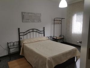 a bedroom with a large bed in a room at Carrer Esparreguera in Olot +25 photos