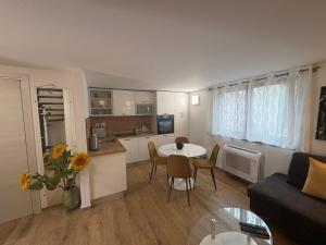 a living room with a couch and a table at Babina Hiža in Pula