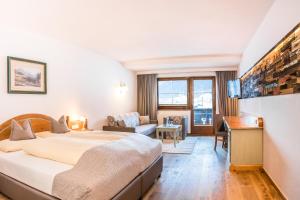 Łóżko lub łóżka w pokoju w obiekcie Hotel Bergjuwel