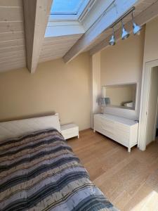 a bedroom with a bed and a large mirror at Dimora Dell Olmo in Civitanova Marche