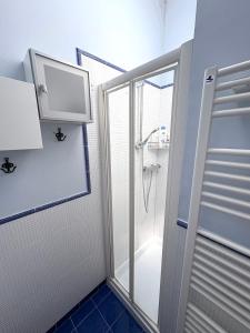 a shower with a glass door in a bathroom at Dimora Dell Olmo in Civitanova Marche