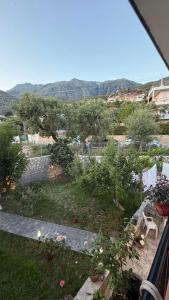 a view of a garden with trees and bushes at Dhoma Elena in Dhërmi