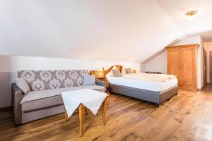 Łóżko lub łóżka w pokoju w obiekcie Hotel Bergjuwel