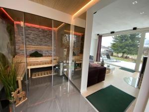 a living room with a glass wall at Cottage2Rest in Erbach