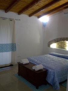 En eller flere senger på et rom på La Quercia