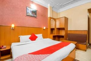 a bedroom with a large bed in a room at HOTEL Embassy in Rānchī