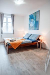 a bedroom with a bed in a room at Apartmány Ve Mlejně in Čachrov +72 photos