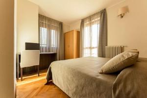 Voodi või voodid majutusasutuse Hotel Maloia toas