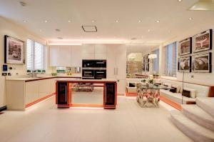 a large kitchen with a counter and a table at MariaHilferHome in Vienna
