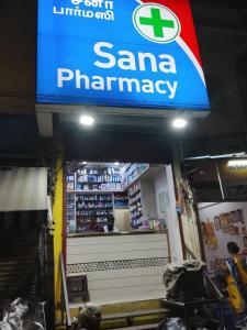 a santa pharmacy sign in a grocery store at JSM DELUXE Ac in Vellore