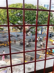 a view from a window of a busy city street at JSM DELUXE Ac in Vellore +14 photos