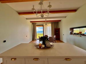 a kitchen with a island in the middle of a room at Guesthouse near Tbilisi in Saguramo